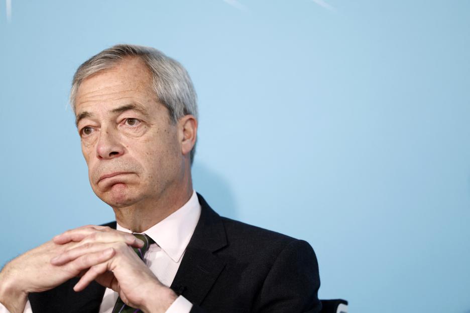 Nigel Farage, leader of Reform UK, looking pensive during a press conference.