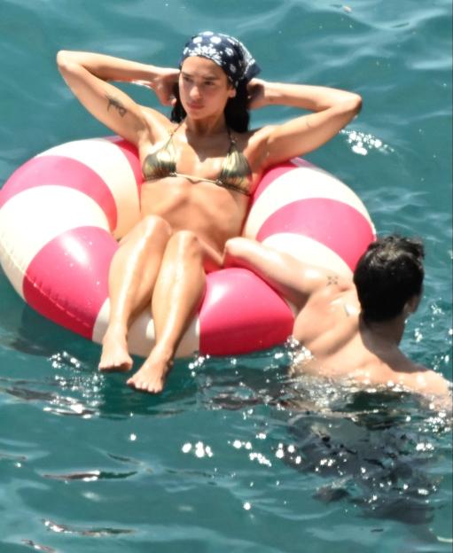*PREMIUM-EXCLUSIVE* MUST CALL FOR PRICING BEFORE USAGE - Newlyweds Dua Lipa and Callum Turner looked every inch the loved-up couple as they soaked up the sunshine on the stunning Amalfi Coast during their romantic Italian honeymoon.