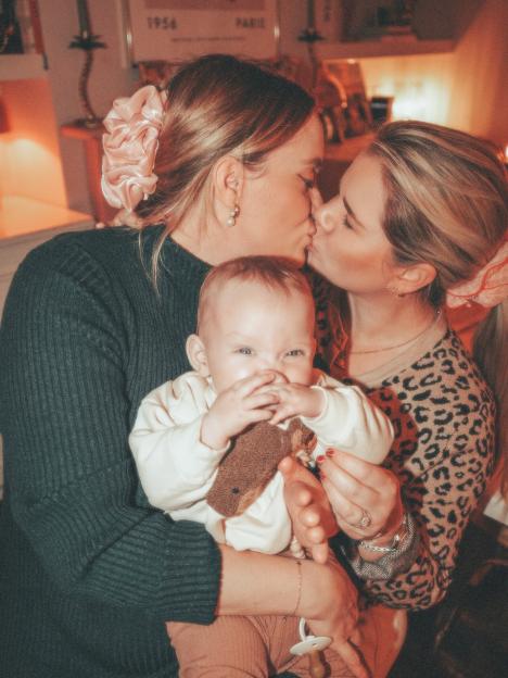 Married lesbians mistaken for twins welcome first child together.