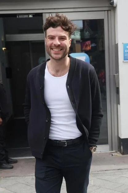 Jordan North smiling outside Global Radio Studios in London.