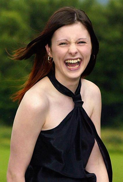 Callie Rogers laughing, with her hair blowing to her left.