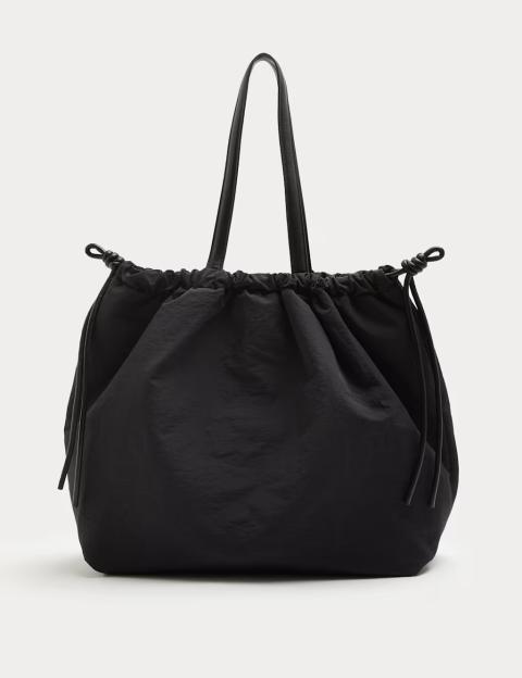 Say Goodbye to Handbags: Discover the Must-Have ‘It’ Bag from M&S That Fits Everything from Sneakers to Laptops!