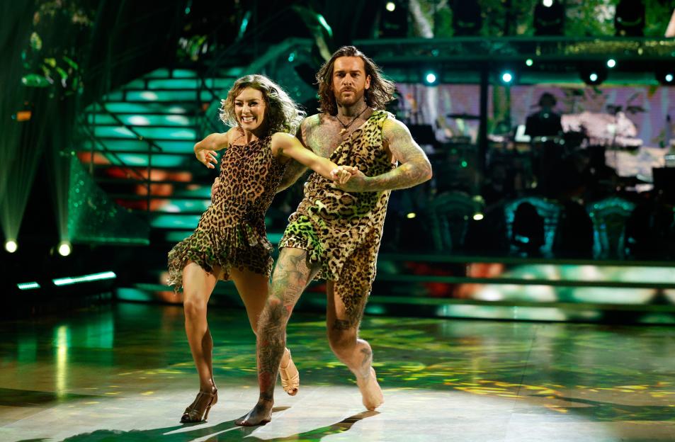 Pete Wicks and Jowita Przystal perform in leopard print outfits.