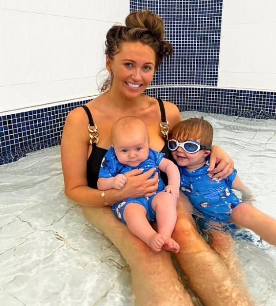 Charlotte Dawson in a pool with her two children.