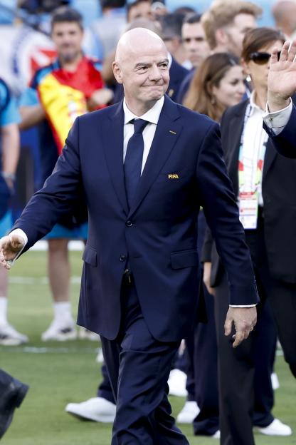 FIFA President Gianni Infantino in a navy suit during the trophy ceremony.