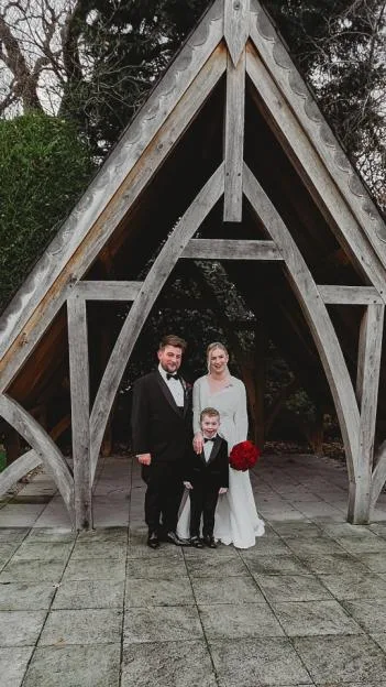 Jess-Hulley Jones, Damon, and their son Theodore on their wedding day.