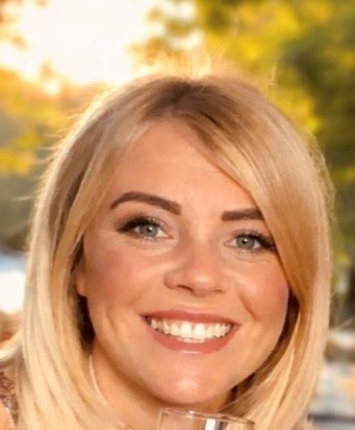 Bethany Hewitt, a woman with blonde hair, smiling at the camera.