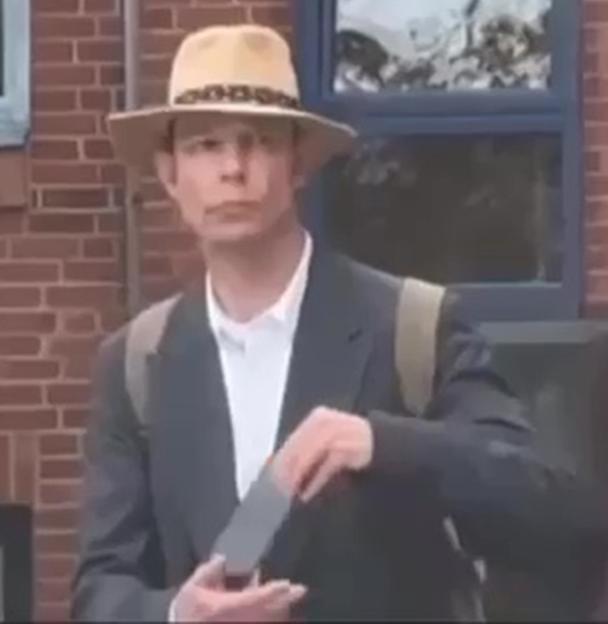 Christian Brueckner wearing a Panama hat and jacket.