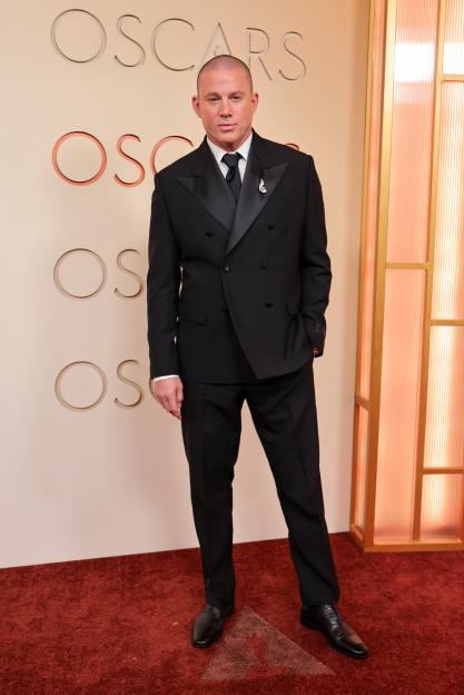 Channing Tatum in a black tuxedo on the red carpet at the 98th Annual Oscars.