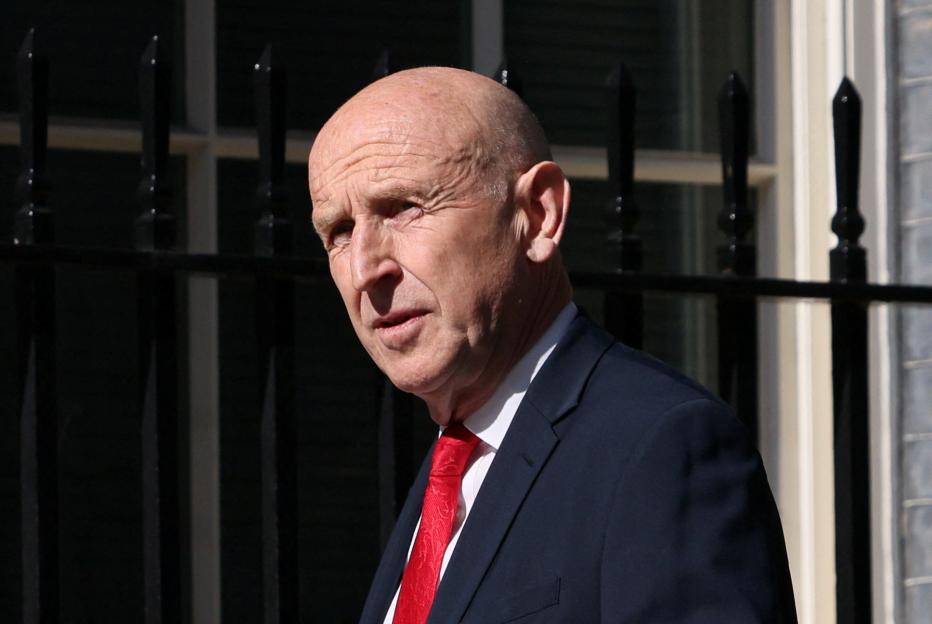 John Healey walks on Downing Street