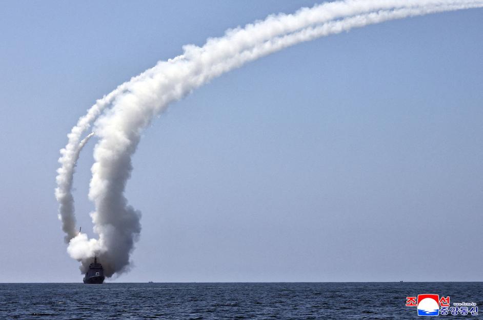North Korean leader Kim Jong Un observes a cruise missile launch