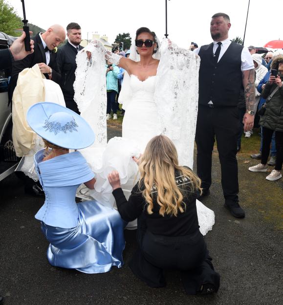 Venezuela Fury, in her wedding dress and sunglasses, with Paris Fury beside her, arriving for her wedding.
