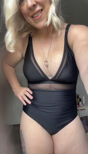 Woman in a stylish black swimsuit