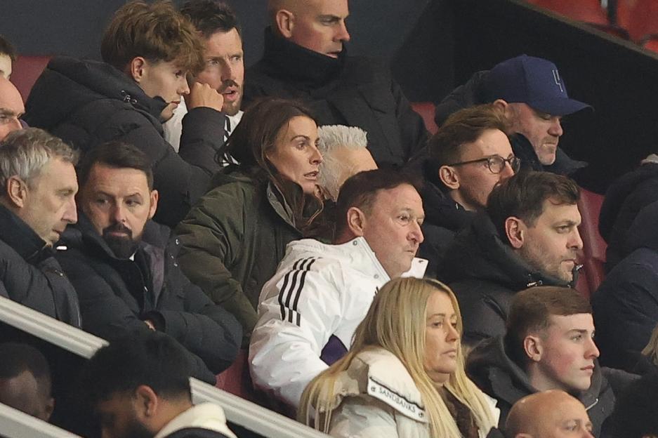 Coleen and Wayne Rooney watching a game from the stands.