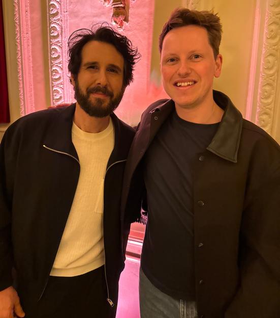 Howell Davies and Josh Grobin standing next to each other and smiling.