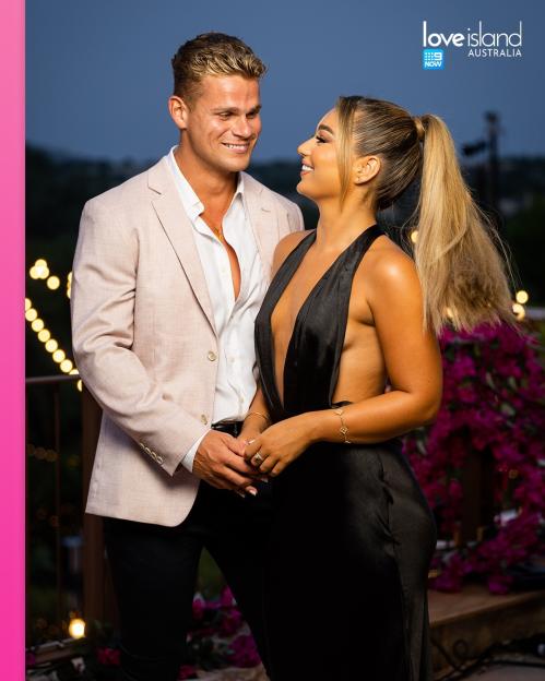 Zac Nunns and Lucinda Strafford of Love Island Australia look at each other and smile.