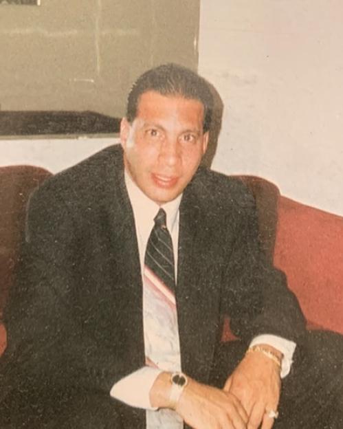 Anthony Ruggiano Jr. smiling in a suit.