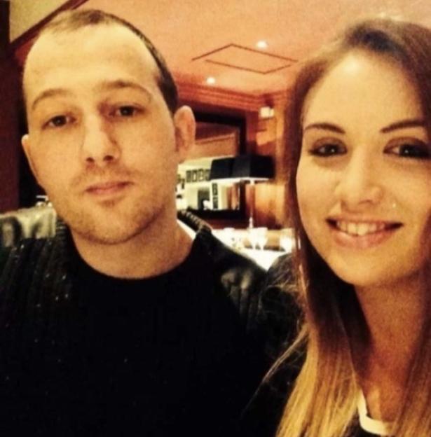 A man and a woman posing for a picture.
