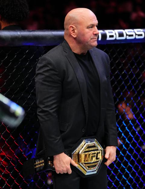 UFC President Dana White holding the championship belt.