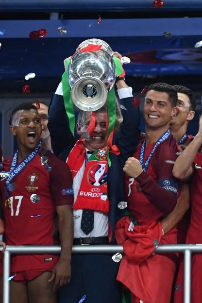 Nani and Cristiano Ronaldo lift the Euros cup after a successful campaign
