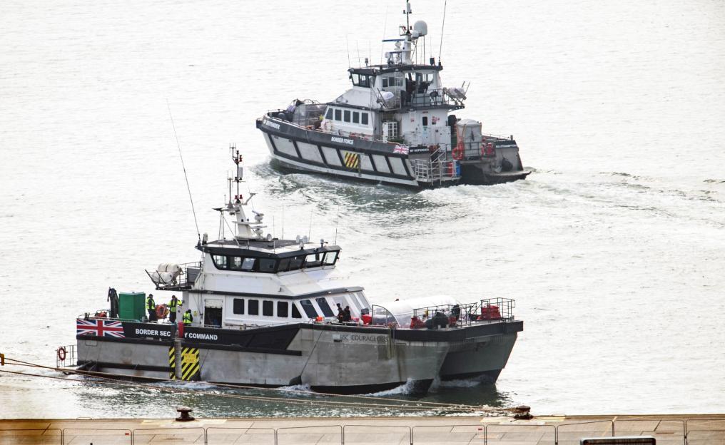 Two Border Force vessels, BF Defender and BSC Courageous, escort migrants into Dover Docks.
