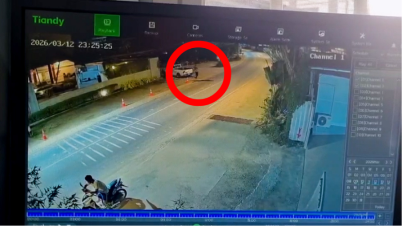 CCTV footage showing Jordan Wright grabbing onto a white Toyota pickup truck.