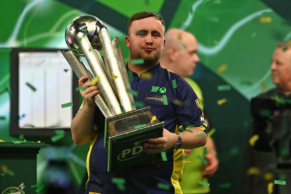 Luke Littler with the Sid Waddell Trophy after winning the PDC World Darts Championship.