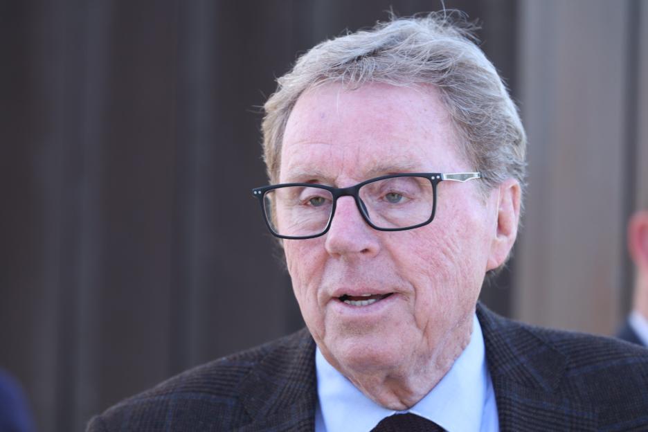 Harry Redknapp in glasses attends the races at Newbury racecourse.