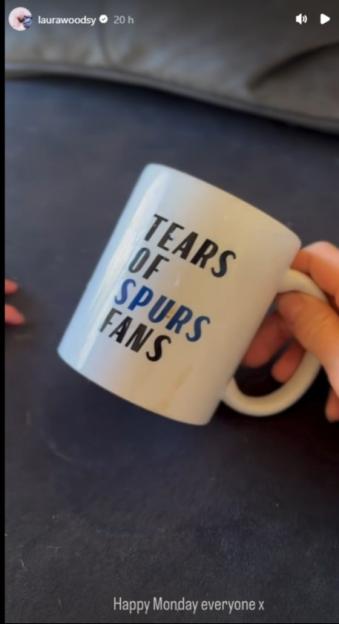 Hand holding a mug that says "Tears of Spurs Fans".