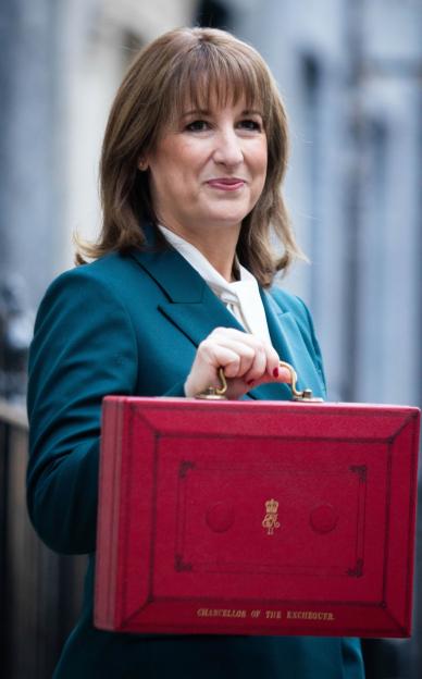 Chancellor of the Exchequer Rachel Reeves holding her red ministerial budget box.