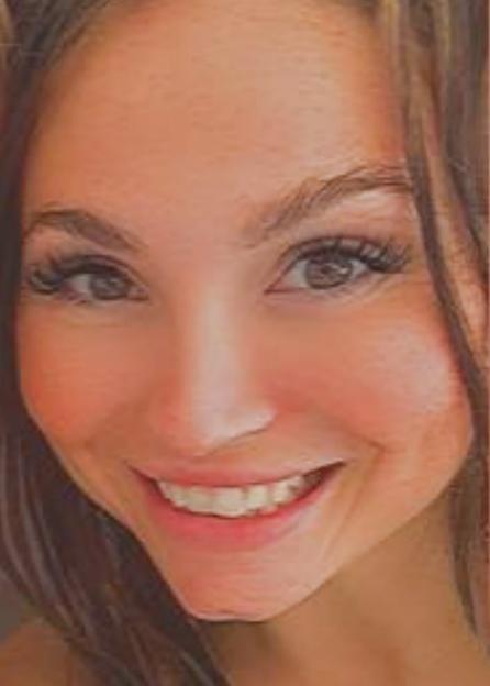 A close-up of Samantha Murphy smiling, her dark hair framing her face.