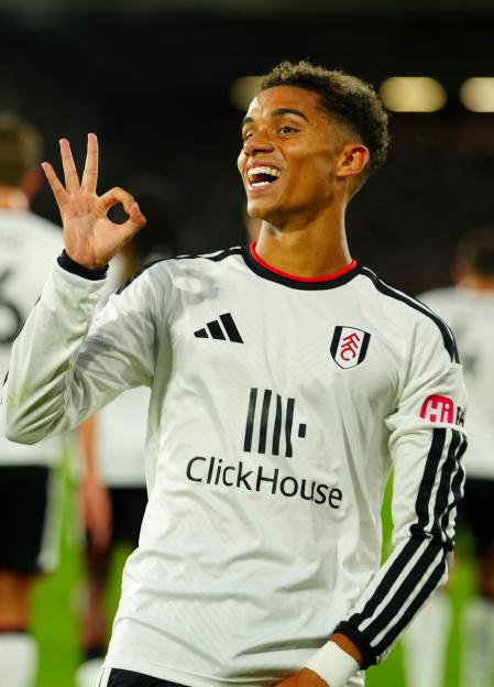 Josh King of Fulham celebrates scoring the opening goal with an "okay" hand gesture.
