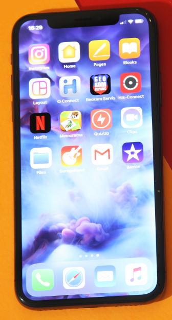 A smartphone displaying a home screen with various app icons, including Instagram, Netflix, and Gmail.