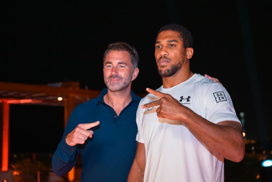 Anthony Joshua and Eddie Hearn posing for a photo.