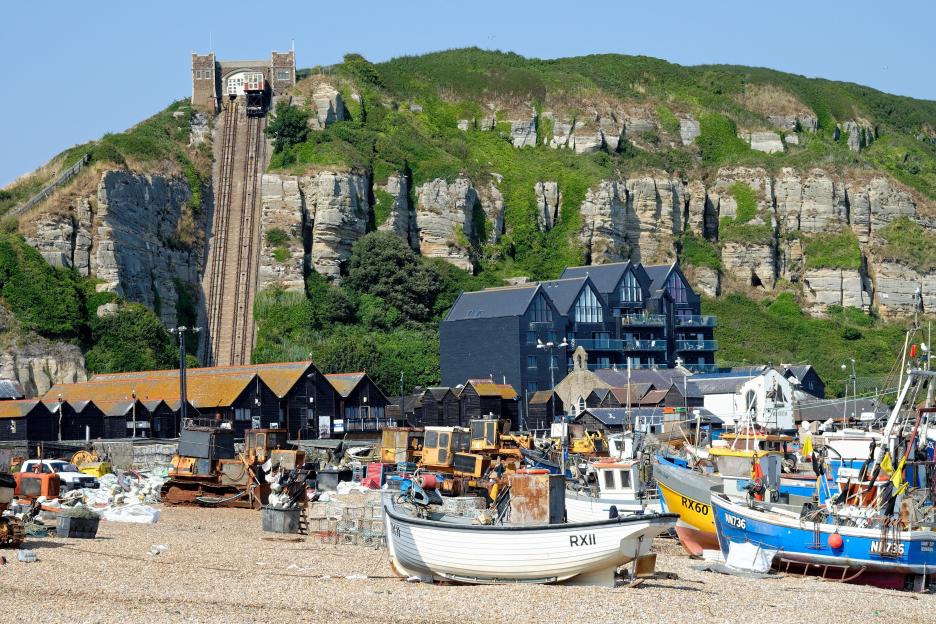 Hastings Old Town beach with fishing boats and the cliff railway.