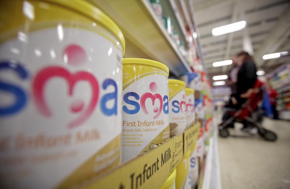 Tins of SMA powdered infant formula are displayed for sale in a supermarket.