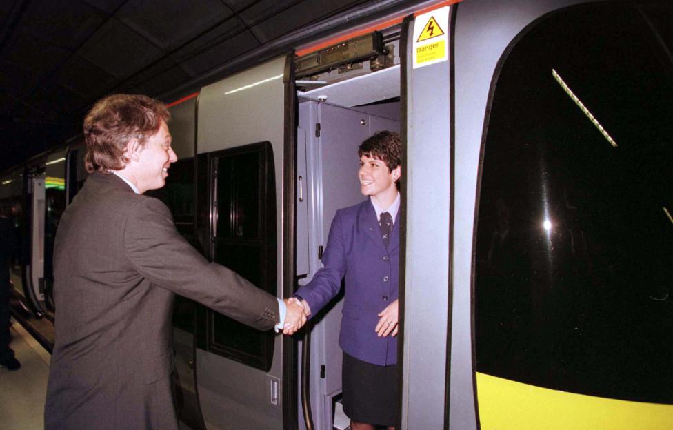 Prime Minister Tony Blair shaking hands with Heathrow Express train driver Claire Pick.