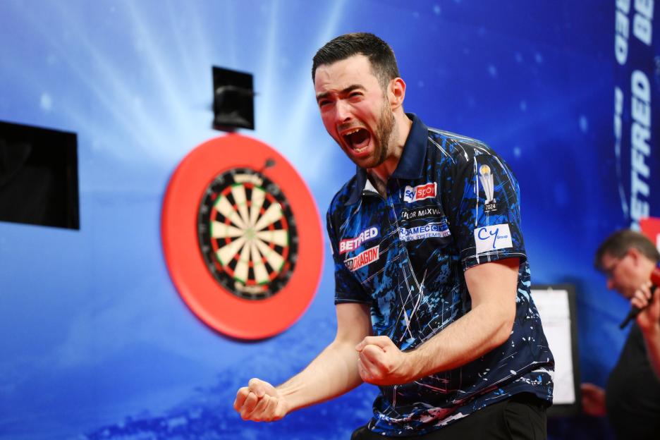 Luke Humphries of England celebrates winning the 2024 Betfred World Matchplay Finals.