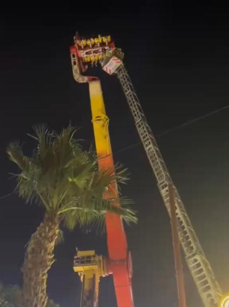 VIDEO: Thrill seekers spend FOUR HOURS dangling 100ft in air after ride malfunctions