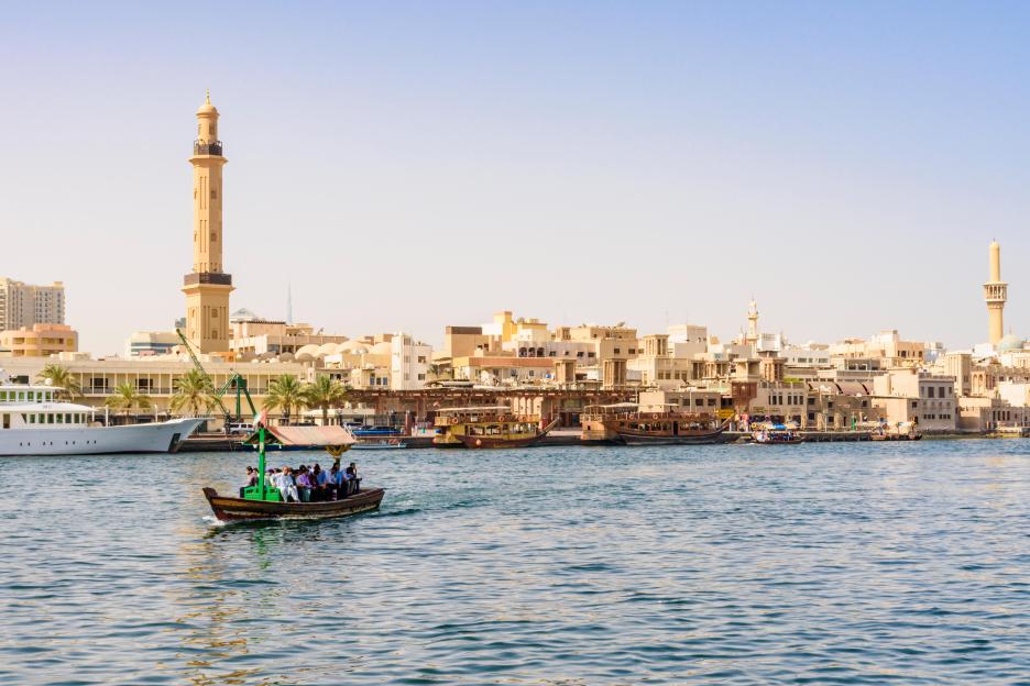 Dubai Creek abra boat with views over to the Grand Mosque Minaret, Dubai Creek, Dubai, UAE