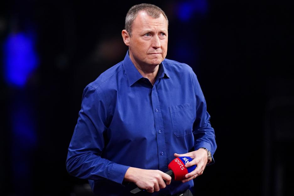 Wayne Mardle, TV presenter, holding a Sky Sports microphone.