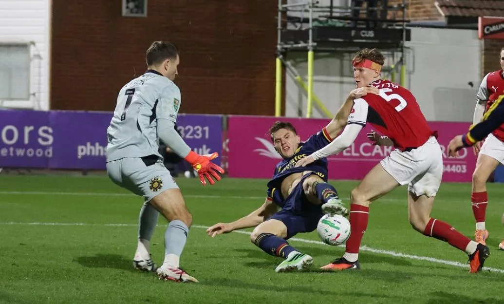 Viktor Gyokeres of Arsenal scores past Fleetwood Town goalkeeper Jay Lynch.