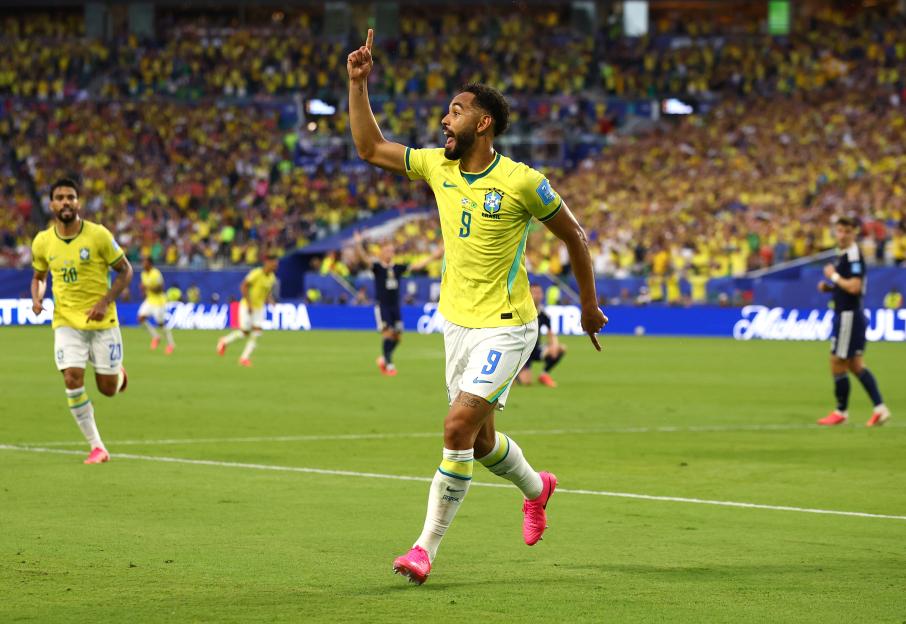 Matheus Cunha of Brazil celebrates scoring his team's third goal.
