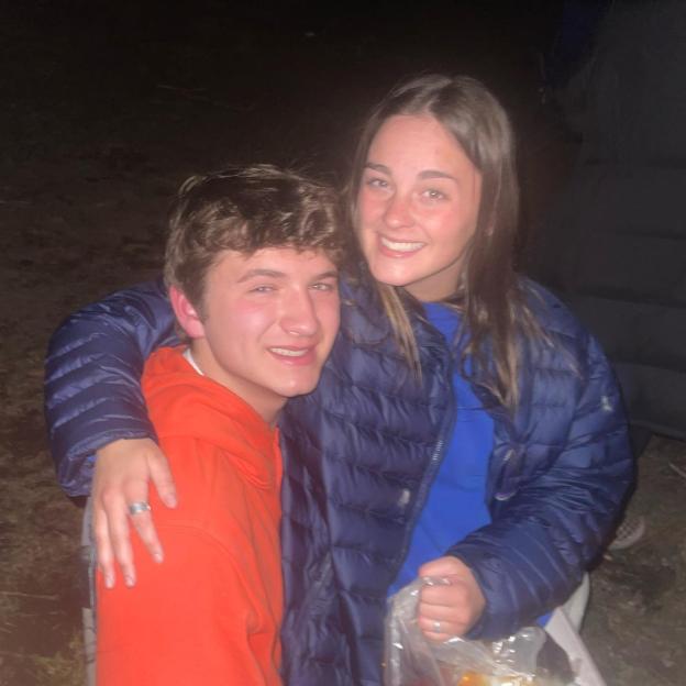 Ethan Chapin and Xana Kernodle smiling while posing with their arms around each other.