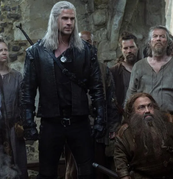 TV still featuring Laurence Fishburne as Regis and Liam Hemsworth as Geralt of Rivia in The Witcher.