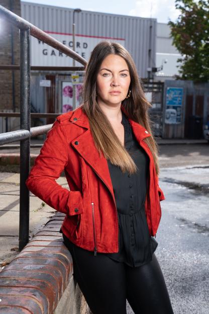Stacey Slater (Lacey Turner) wearing a red jacket.