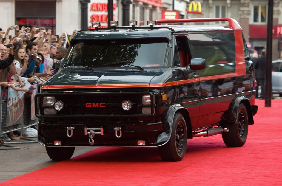 The A-Team GMC van on a red carpet with fans in the background.