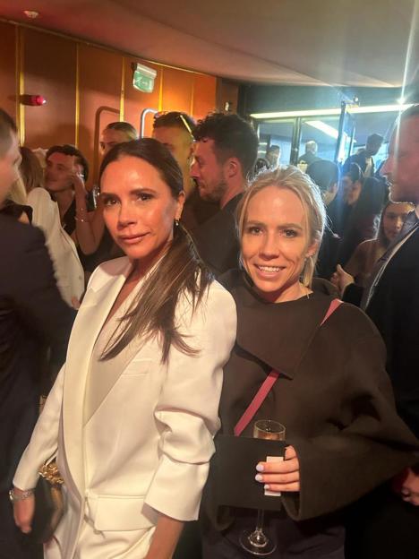 Victoria Beckham and Clemmie Moodie posing for a photo.