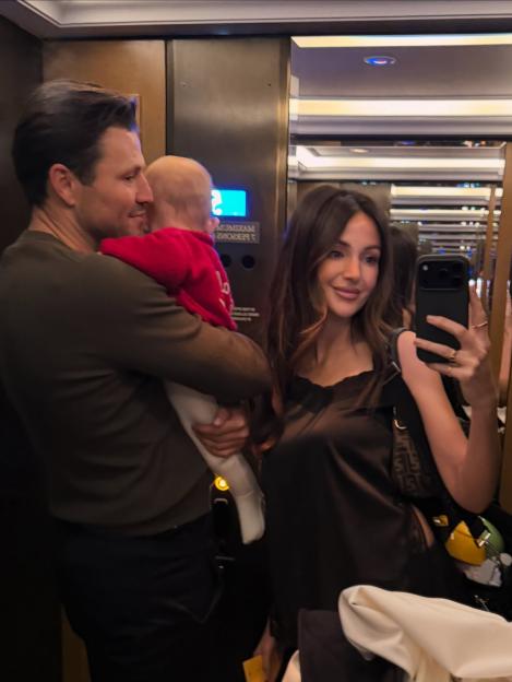 Michelle Keegan, Mark Wright, and their daughter in an elevator selfie.