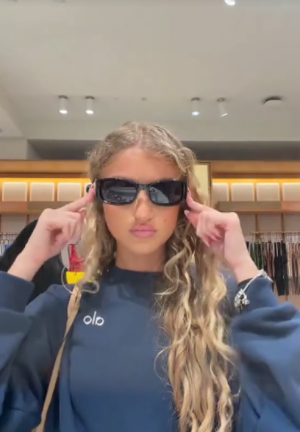 Princess Andre wearing sunglasses in a store.